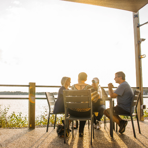 Group of friends at a lakefront.